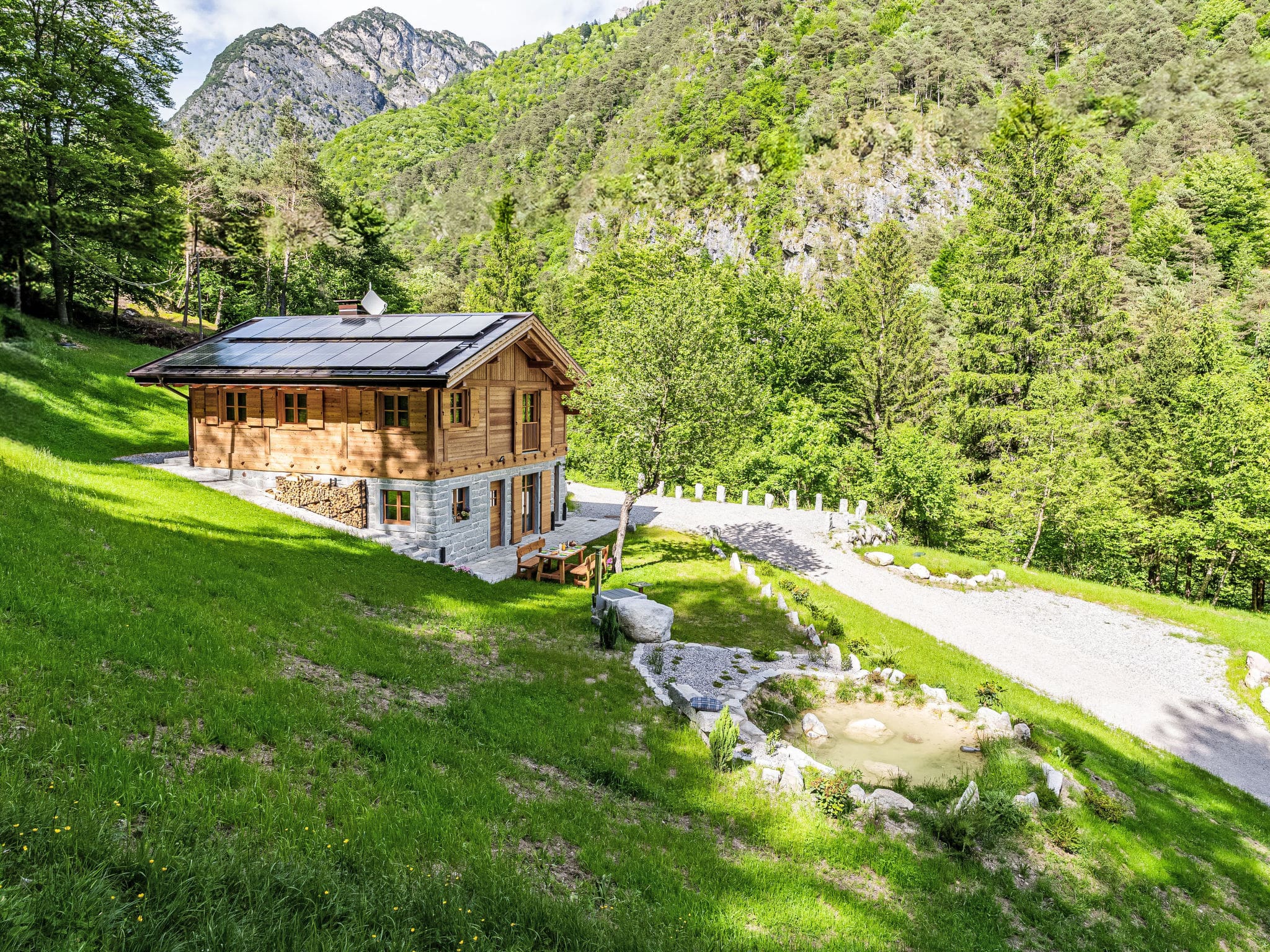 Chalet Dolomia Comano: Stunning 3-Bedroom Alpine Chalet with Mountain Views and Natural Spa Access